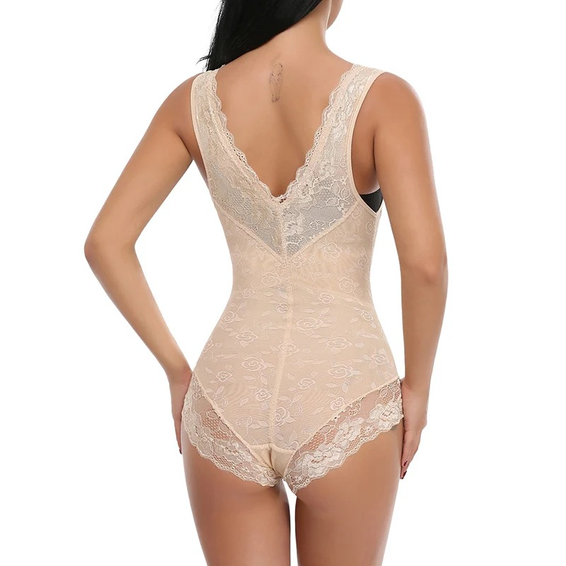 Woman wearing a beige lace open bust shapewear bodysuit on a white background