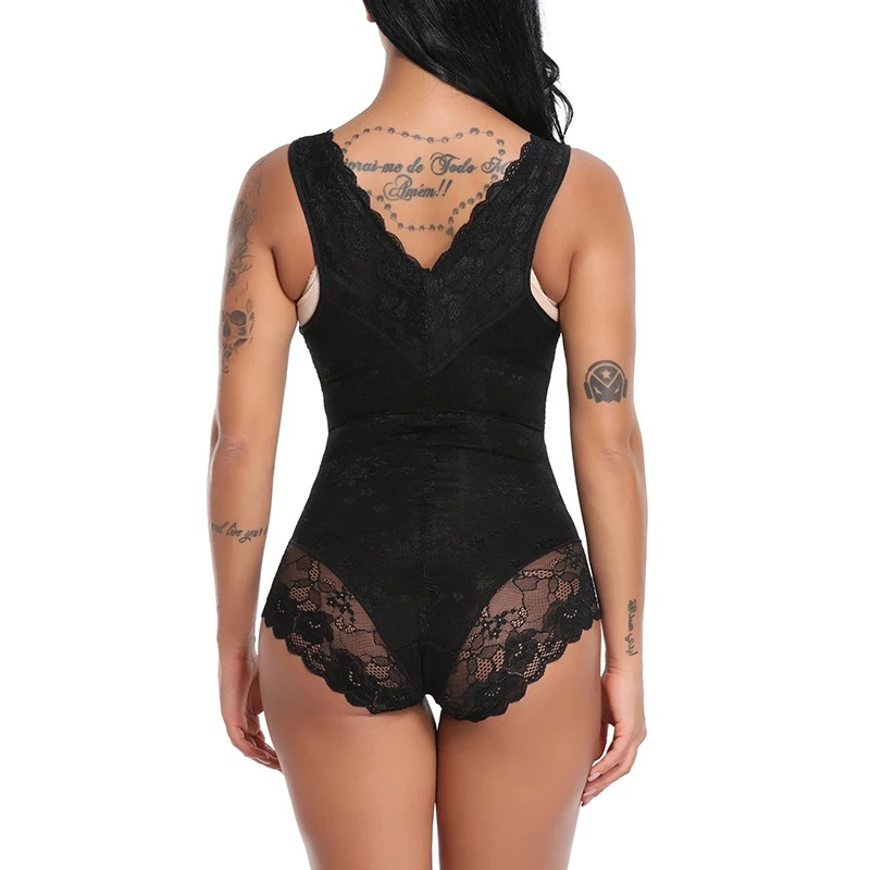 Woman wearing a black lace open bust shapewear bodysuit on a white background