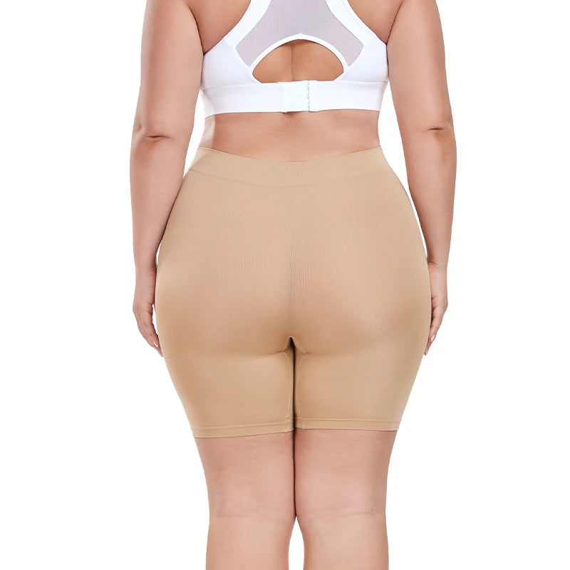 Beige shapewear shorts worn by a person on a white background