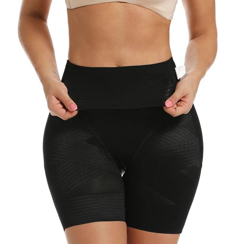 Black shapewear shorts worn by a person on a white background