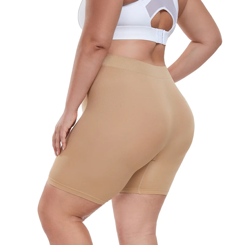 Beige shapewear shorts worn by a person on a white background