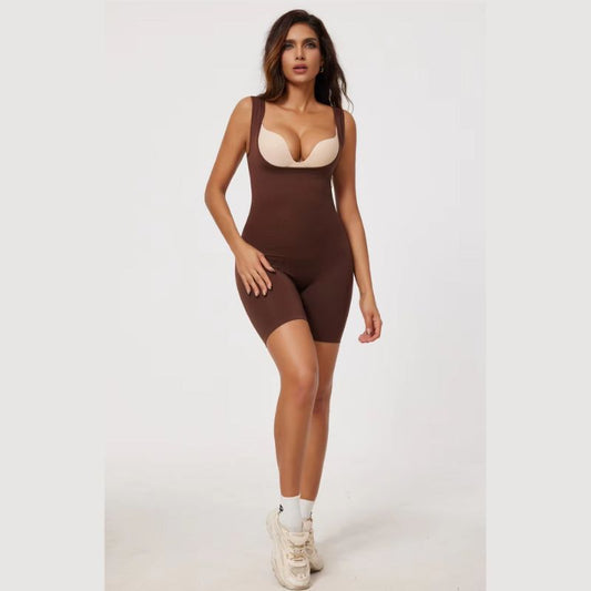 Woman wearing a brown bodysuit on a white background