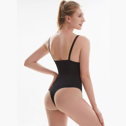 Woman wearing a black shapewear bodysuit on a white background