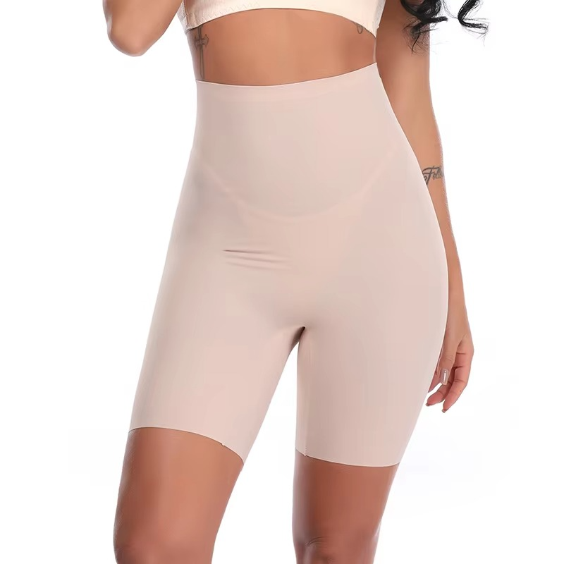 Beige shapewear shorts worn by a person on a white background