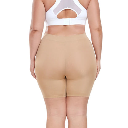 Beige shapewear shorts worn by a person on a white background