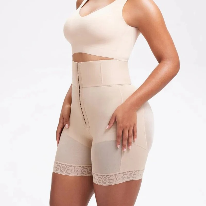 Beige shapewear worn by a model on a white background