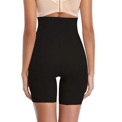 Black shapewear shorts worn by a model on a white background