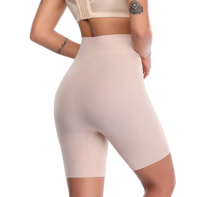 Beige shapewear shorts worn by a person on a white background