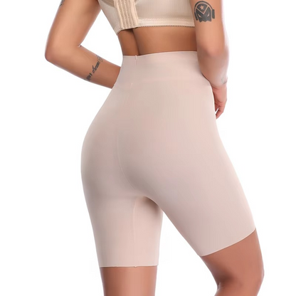 Beige shapewear shorts worn by a person on a white background
