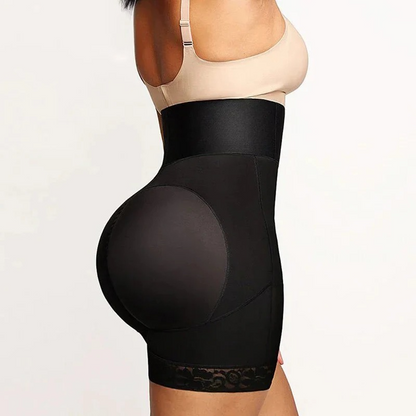Woman wearing a black waist trainer with lace details on a plain background